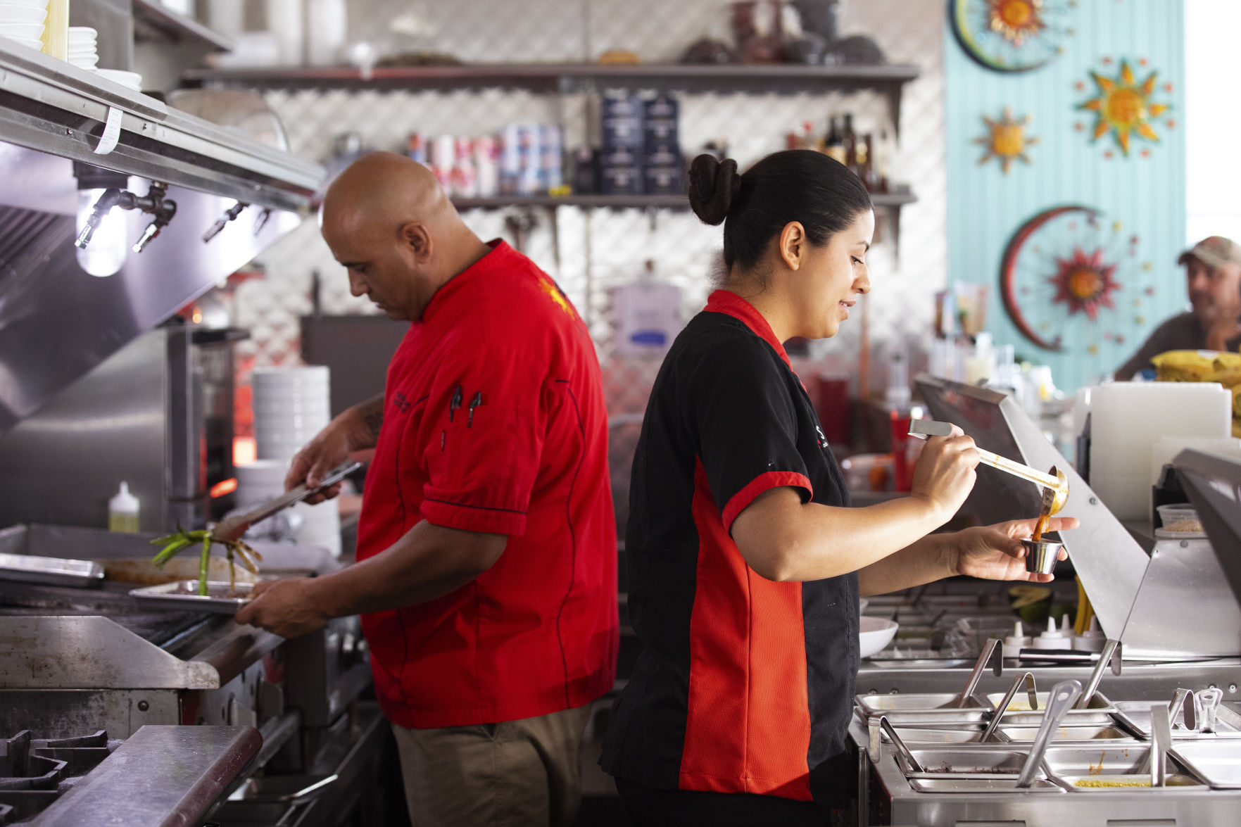 Armando and Esmeralda Cooking.jpg